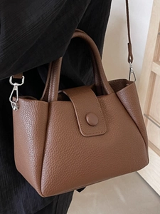 Brown litchi grain leather bucket bag with top handles and adjustable strap for women