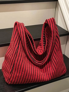 Chic red and black striped knitted hobo bucket bag with a spacious shoulder design