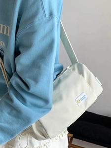 Waterproof cream nylon crossbody pillow bag for casual daily commute with strap