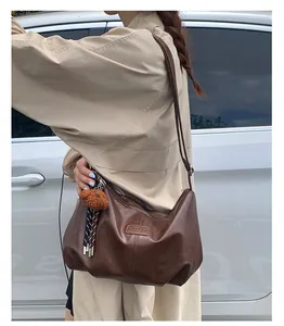 Brown leather large capacity Hobo shoulder bag with cute plush bear charm detail