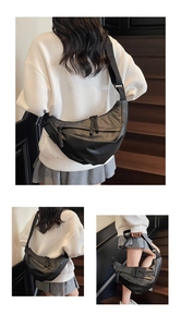 Detail views showing black nylon crescent crossbody bag capacity and woven zipper puller