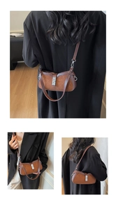 Detail view of retro color-block bag showing suede texture and silver twist lock closure