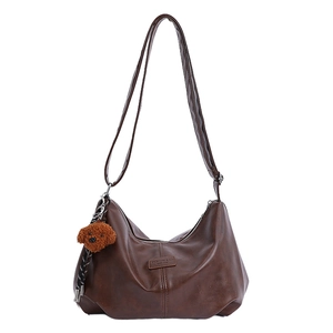 Deep brown soft faux leather hobo bag with a cute puppy plush charm for women