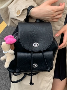 Retro black PU leather drawstring backpack with silver buckles and plush dog charm for travel