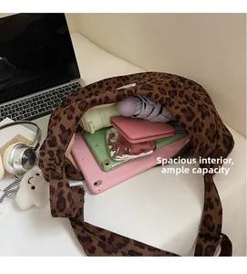 Macro view of large leopard print tote bag interior capacity holding iPad and essentials