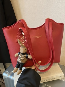 Chic red faux leather tote bag with large capacity and cute rabbit charm for daily commute