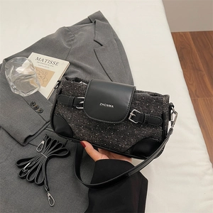 Close-up of dark grey tweed shoulder bag with leather flap and ZHCNMA logo detail