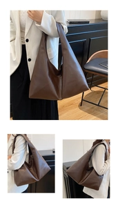 Detail view of large dark brown PU leather tote bag with wide strap and hobo silhouette