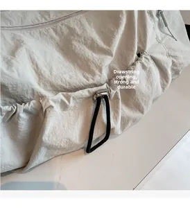 Detail of high-capacity tote bag showing durable nylon texture and drawstring closure
