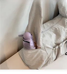 Detailed close-up of side zipper pocket with umbrella showing high capacity storage space