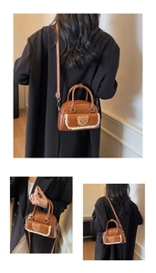 Detail view of retro brown crossbody bag with teddy bear patch and lace trim details