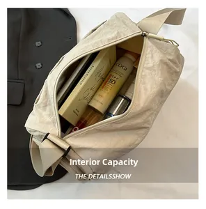 Top view of large capacity beige nylon tote bag showing internal storage for daily items