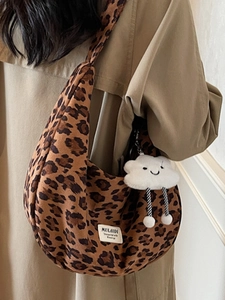 Chic leopard print canvas tote bag for women with cute cloud plush charm on shoulder strap