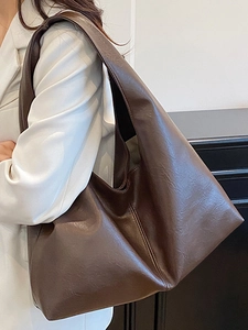 Minimalist large capacity dark brown leather tote bag for women showing crossbody style