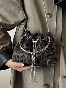 Vintage leopard print drawstring bucket bag with silver chain strap and tassel detail