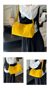 Macro detail of high-quality bright yellow tote bag showing waterproof fabric and stitching
