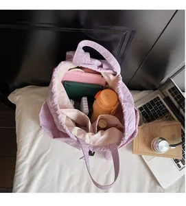 Internal view showing large capacity and multiple pockets of this lavender drawstring bag
