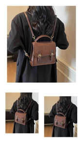 Detail view of the vintage brown backpack's back structure with adjustable leather straps