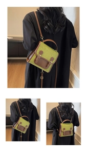 Retro moss green backpack and crossbody bag with leather strap details in a cozy room