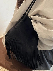 Retro black suede shoulder bag with bohemian long fringe details for women