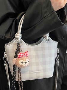 Chic plaid crossbody bag with adjustable shoulder strap and cute bear charm detail