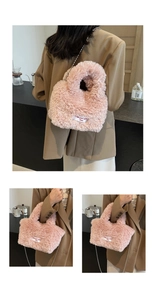 Detail view of pink plush handbag with detachable metal chain and text patch design