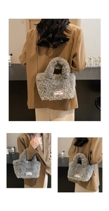 Detailed macro view of the fluffy grey faux fur texture and silver chain strap on bag