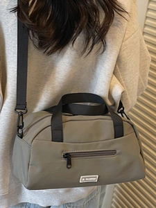 Olive green nylon pillow crossbody bag with JL FASHION label and wide shoulder strap