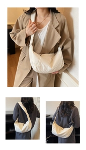 Detail of a beige quilted crescent shoulder bag showing soft texture and crossbody style