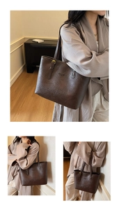 Detail view of large dark brown tote bag with fashion bag text and adjustable strap