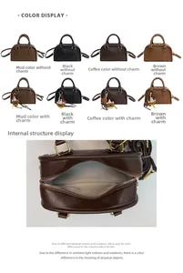 Detailed view of the zip closure and light fabric lining of a vintage leather Boston bag