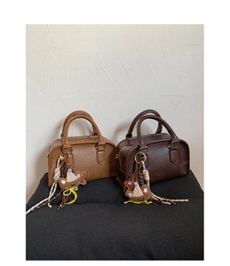Detail of mini Boston handbags with vintage texture, ZSKFK PARIS logo and bear charms