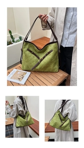 Detail of green quilted suede tote bag with brown leather straps and gold hardware