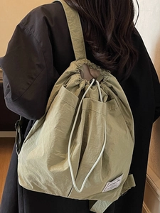 Waterproof drawstring backpack in light olive green with a large capacity unisex design