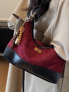Retro burgundy and black suede hobo bag with quilted pattern and gold turn-lock
