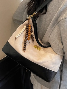 Vintage quilted contrast color shoulder bag with gold twist lock and wooden bead chain