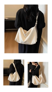 Detail view of the white high-capacity hobo bag with wrinkled PU leather texture and strap