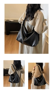 Detail view of large matte black Hobo tote bag showing soft PU leather and spacious design