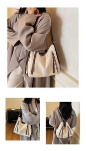 Detail view of cream PU leather bag showing adjustable brown straps and metal zippers