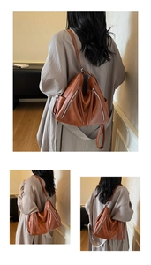Detailed views of a large brown faux leather tote with decorative metal zippers