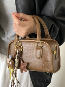 Retro brown mini Boston bag with pleated texture and charming pendant accessories