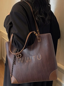 Brown woven leather tote bag with WWTU detail, spacious shoulder bag for commuting