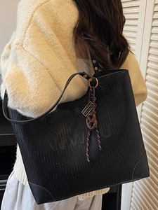 Black woven leather tote bag with WWU embossing and shoulder straps for women