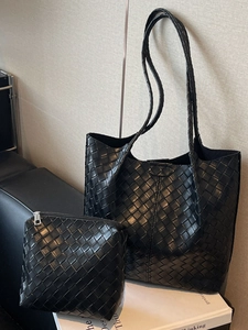 Minimalist black woven leather tote bag set with matching inner pouch for daily commuting