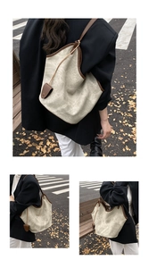 Detail of vintage tote bag featuring stone-patterned canvas and brown leather trim