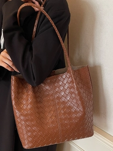 Brown woven leather tote bag for women with large capacity and minimalist design