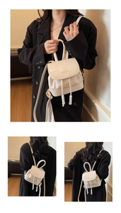Close-up of cream PU leather mini backpack featuring beaded drawstring and gold logo
