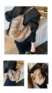 Detail view of large brown tote bag with vintage texture and stylish shoulder strap