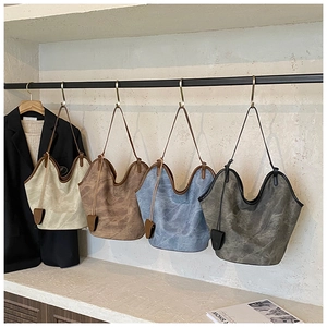 Detail view of large capacity tote bags in four colors with washed leather texture