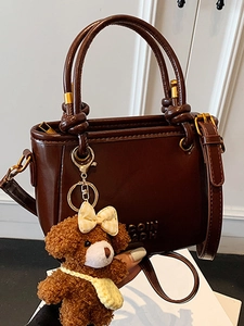 Sac seau marron avec charm ours en peluche et bandoulière réglable pour femmes élégantes